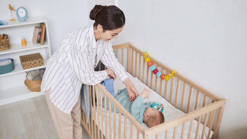 Baby in crib and mom